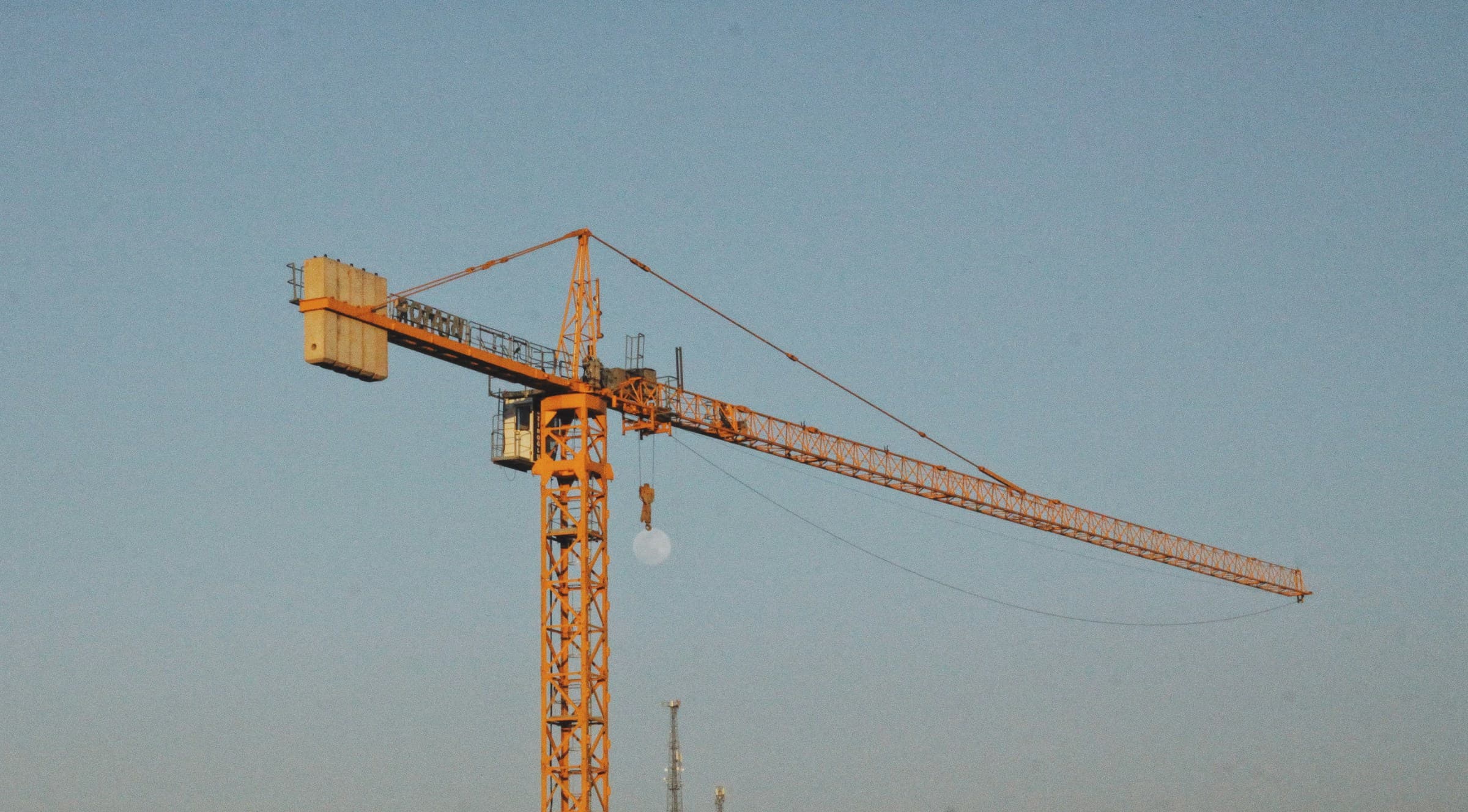 Daylight construction site with cranes and concrete framework in progress